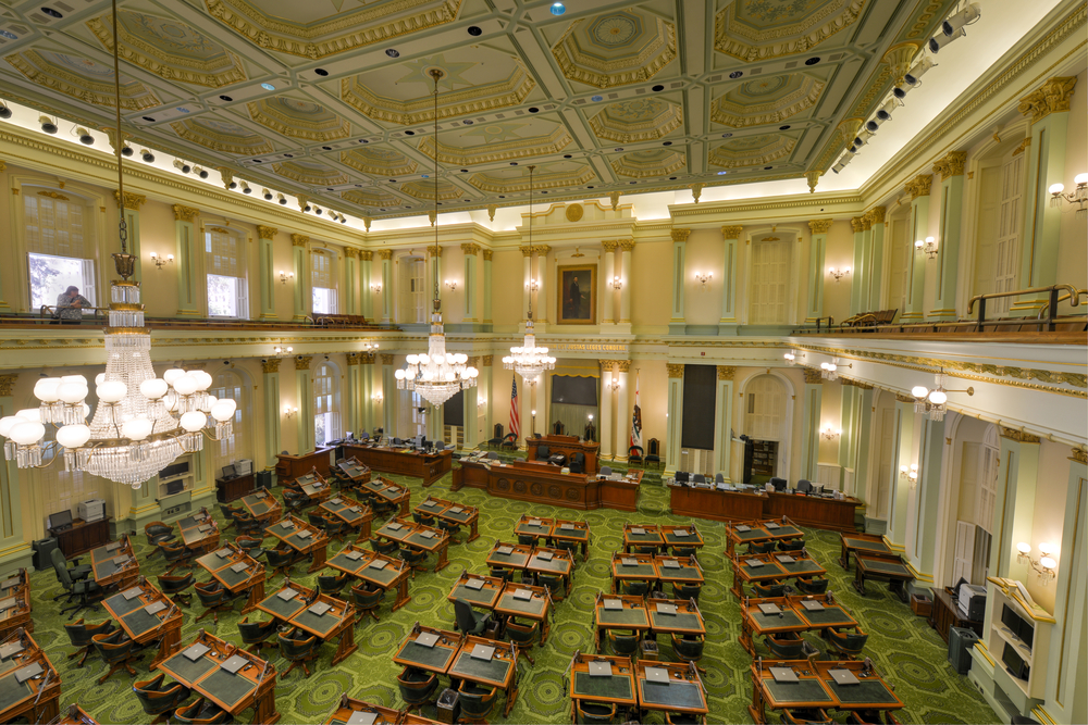 An empty Assembly chamber in the California State Capitol building.