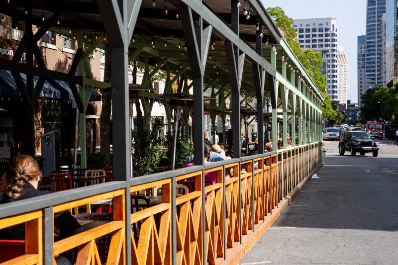 Outdoor dining structures set up on India St. in Little Italy.