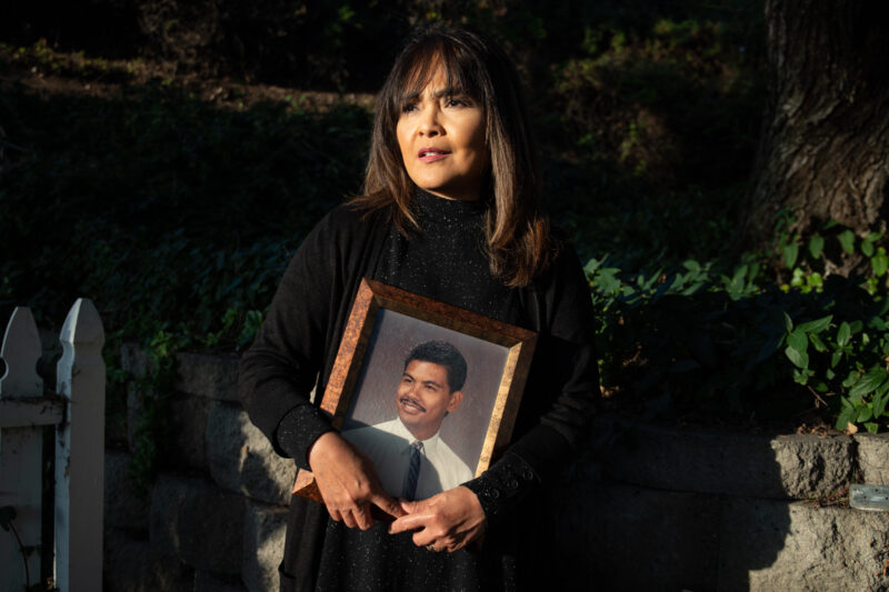 Gemma Rama-Banaag, a chief nursing officer at Paradise Valley Hospital, hold a photo of her late husband Chester Banaag while he was in dental school. Banaag died of COVID-19 complications on December 2020.