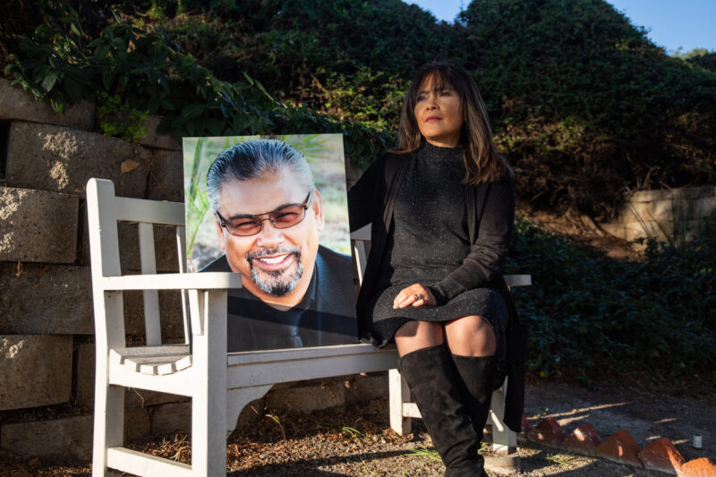 Gemma Rama-Banaag, a chief nursing officer at Paradise Valley Hospital, hold a photo of her late husband Chester Banaag while he was in dental school. Banaag died of COVID-19 complications on December 2020.