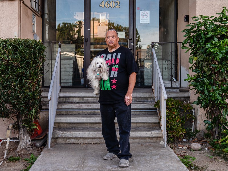 Daniel Palmer, 61 years, a tenant of North Park Towers with his dog DJ in North Park on March 15, 2022. Palmer has a Section 8 voucher but has seen a 86 percent rent increase.