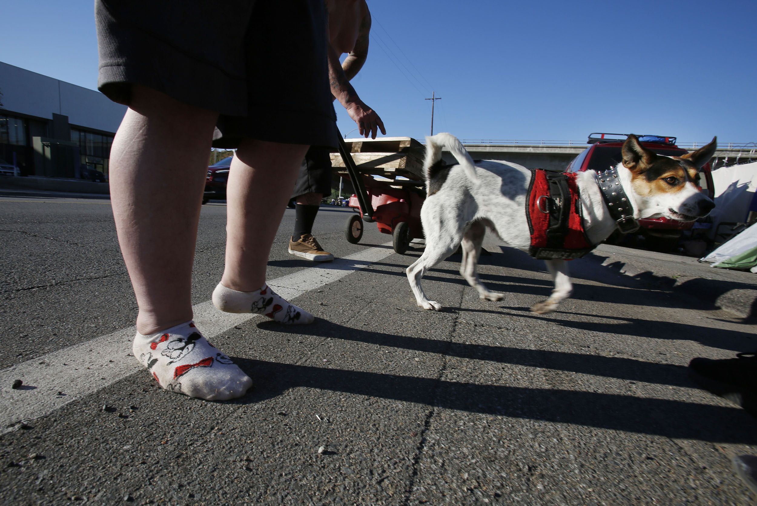 Cara Reeder, 32, a third generation East County native, stands in her socks along the Magnolia encampment
