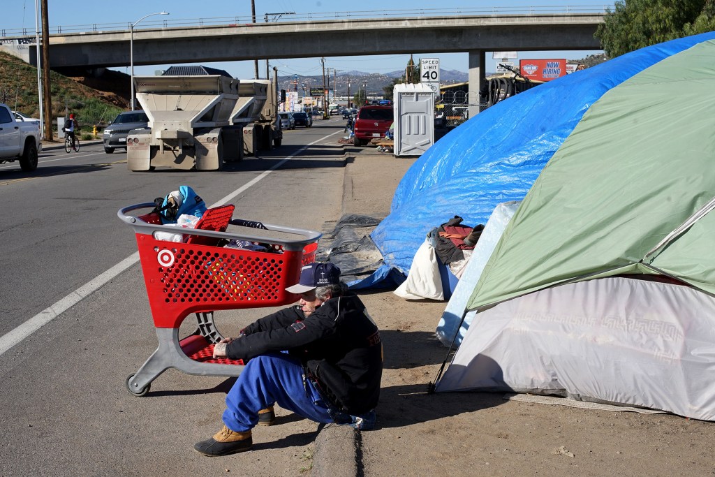 More than two dozen tents, large and small, line the side of Magnolia Avenue in El Cajon Tuesday, March 8, 2022.