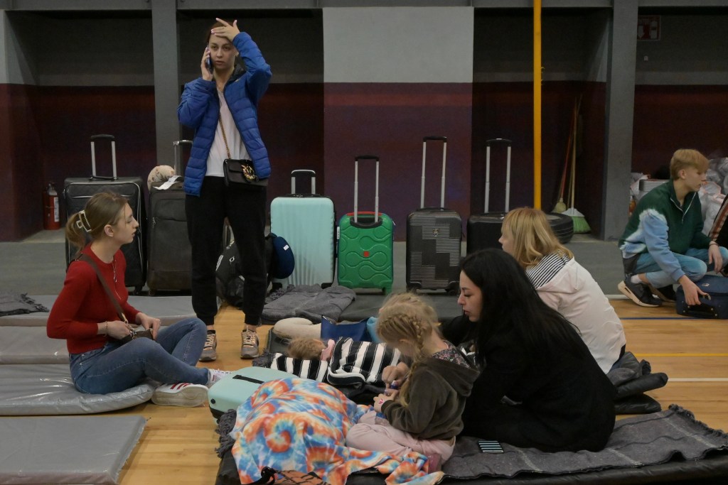 Ukrainian refugees arrive to the Tijuana Benito Juarez Sports Complex shelter where more than 2,000 people are waiting for asylum to enter the United States, after the Biden Administration announced back in March that 100,000 Ukrainians would be allowed to enter under Temporary Protected Status (TPS) on Saturday, April 2, 2022.