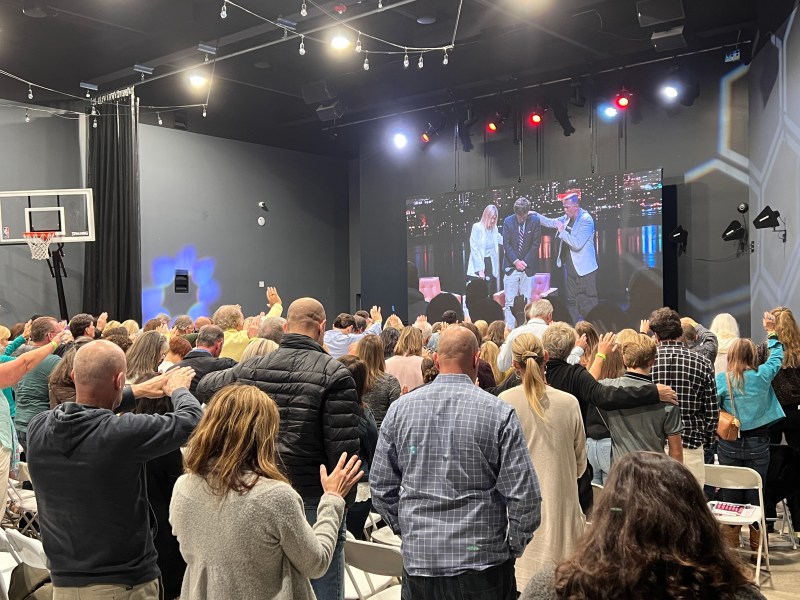 Fox News pundit Tucker Carlson spoke to a crowd gathered both in the auditorium of Awaken's San Marcos campus and in an adjacent overflow room. His speech contained all of the fiery politics of his talk show, with an extra dose of spiritual warfare./ Photo by Jakob McWhinney