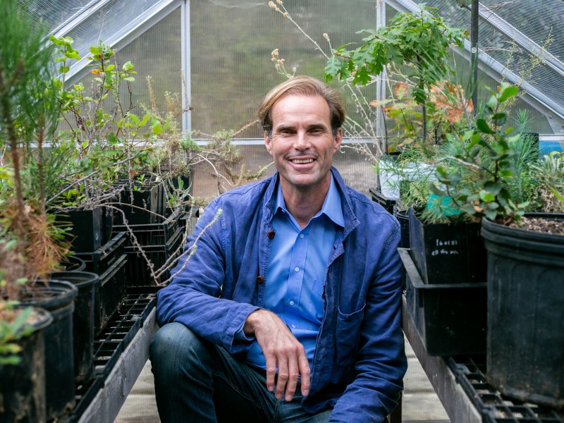 Cody Petterson poses inside his plant nursery where he nurtures indigenous plants at his home in La Jolla, CA.