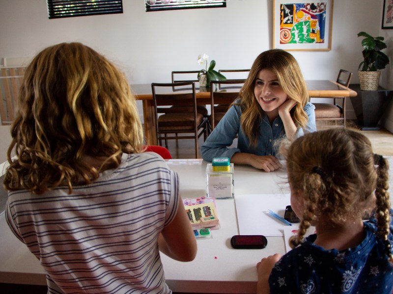 Shana Hazan, SDUSD board candidate talks to her daughters about their day at school in their home in San Diego, CA.