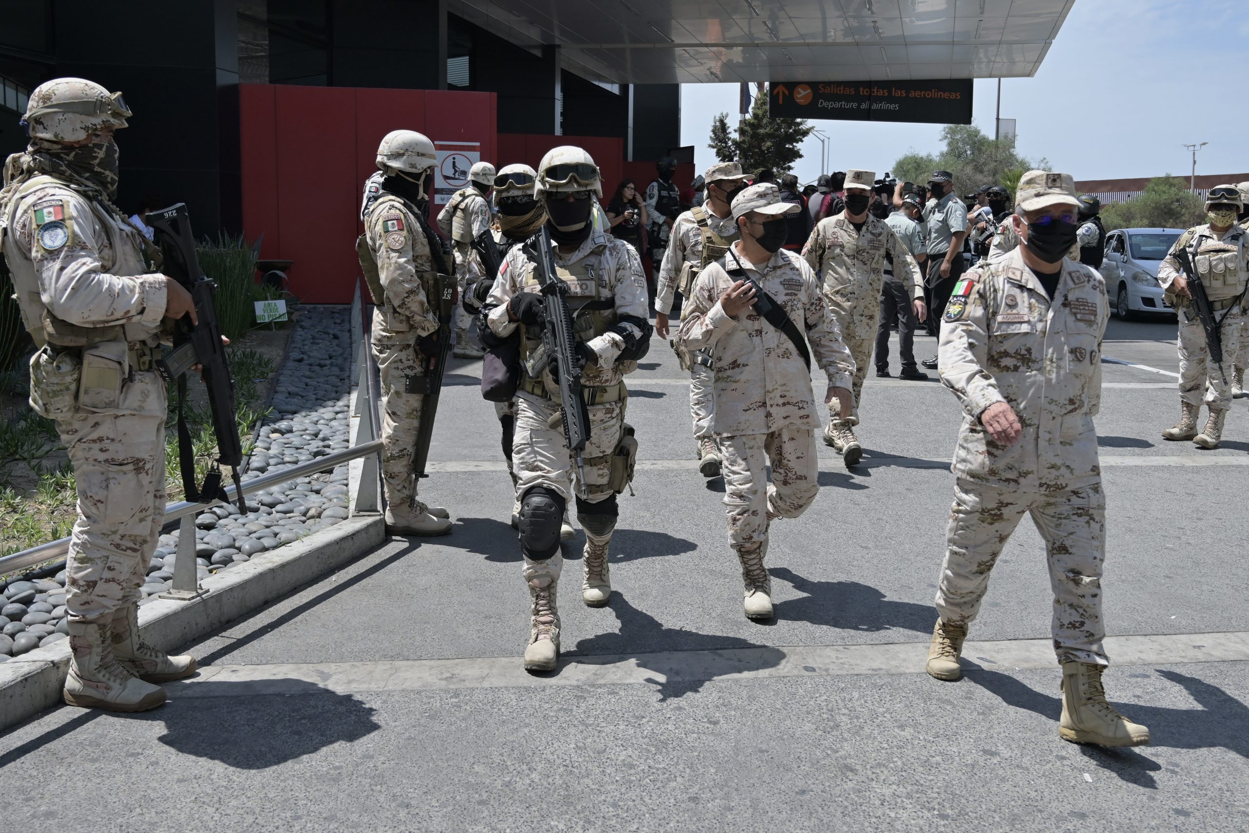 A convoy of three hundred military troops joined the elements of Mexico’s National Guard at the Tijuana International Airport, on Saturday, Aug.13, 2022, in response to Friday’s simultaneous attacks on public transit and vehicles from armed crime organizations all over Baja California. / Photo by Carlos A. Moreno for Voice of San Diego