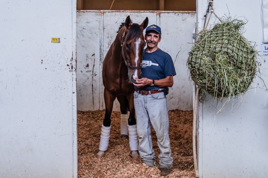 Horse Groomer Felipe Pulido poses for photo at the Del Mar Fairgrounds on July 29, 2022.