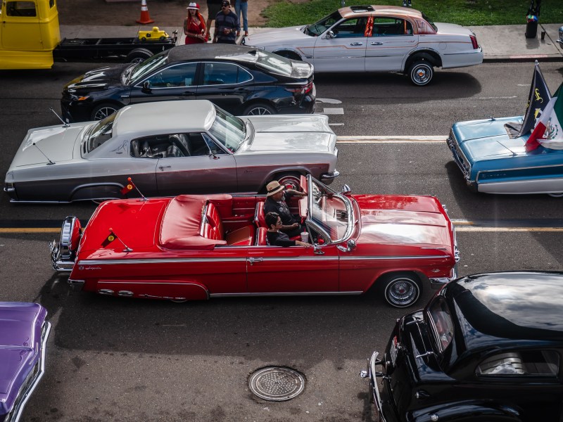 Marcos and Jovita Arellano cruise in an Impala convertible in Barrio Logan on Oct. 16, 2022.