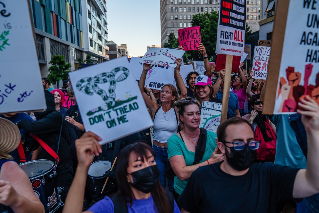 Protesters march through downtown in response to the decision that the U.S. Supreme Court reversed Roe v. Wade on June 24, 2022.