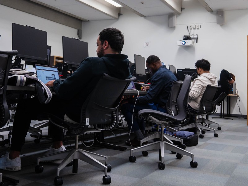 Students listen to Professor David Kennemer during a cyber security class at San Diego City College on Nov. 29, 2022.