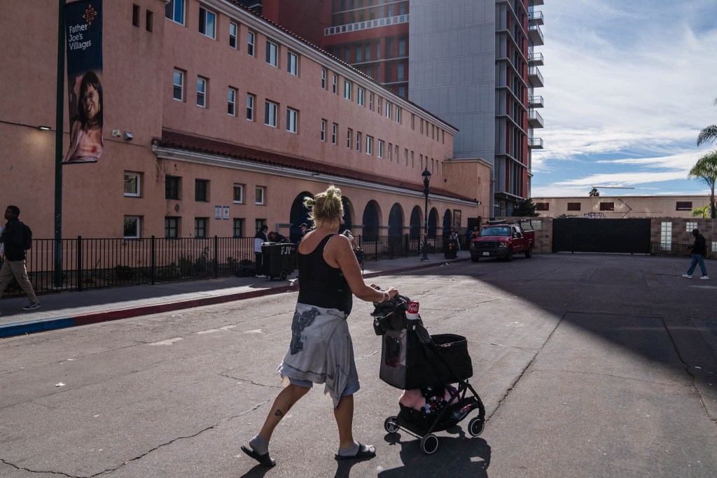 Julie Tucker, 51, walks to the Father Joe's Villages health center where she receives medication-assisted treatment. / Photo by Ariana Drehsler