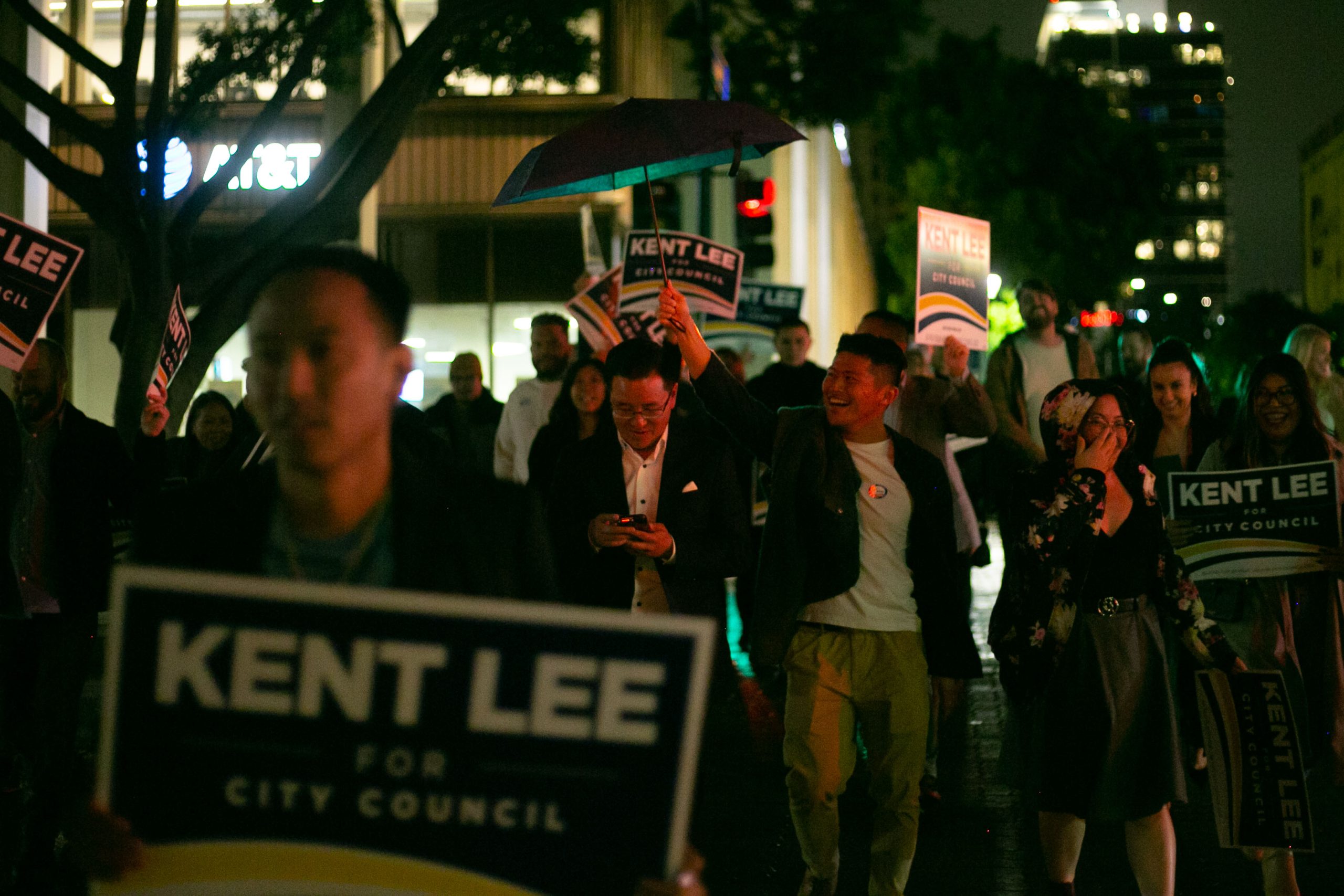 San Diego City Council District 6 Candidate Kent Lee walks with supporters in downtown on election night. / Photo by Brittany Cruz-Fejeran for Voice of San Diego