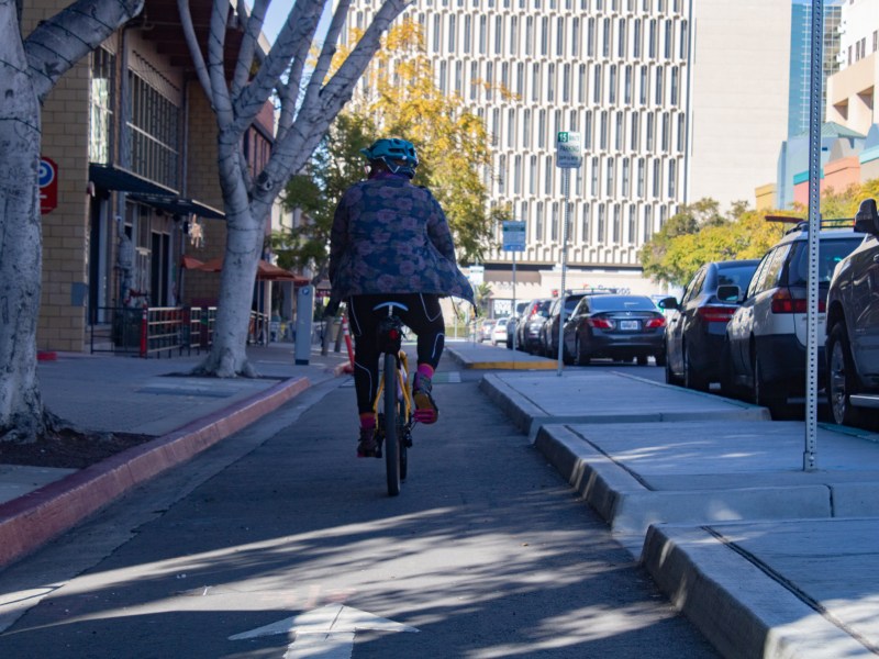 A bicyclist in Hillcrest on Dec. 20, 2022.