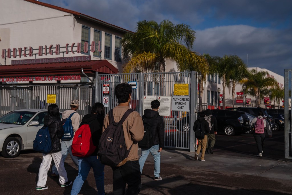 Students enter Hoover High School in City Heights on Nov. 29, 2022.