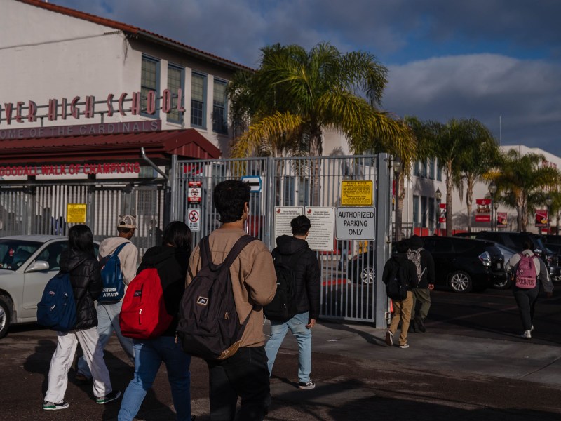 Students enter Hoover High School in City Heights on Nov. 29, 2022.