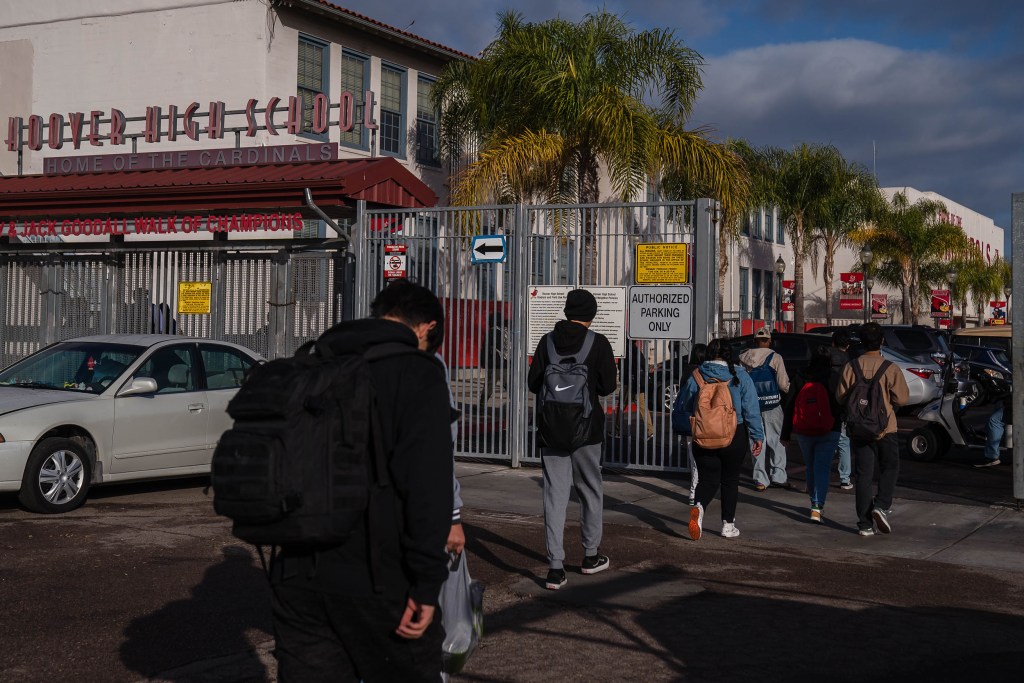 Students enter Hoover High School in City Heights on Nov. 29, 2022.