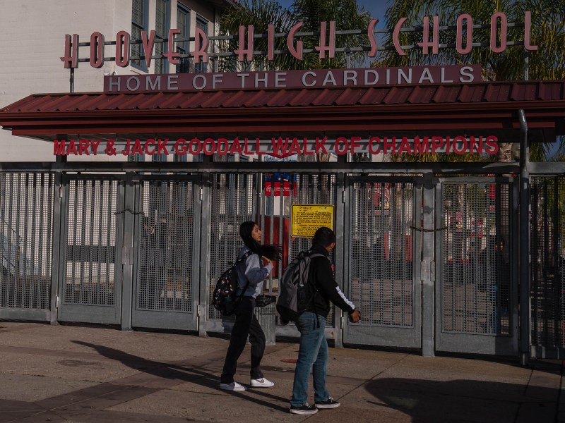 Students enter Hoover High School in City Heights on Nov. 29, 2022.