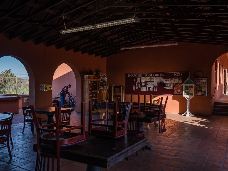 Micheal Weidekemper, 58 years old, works on his bike at La Posada de Guadalupe shelter in Carlsbad on Dec. 13, 2022.