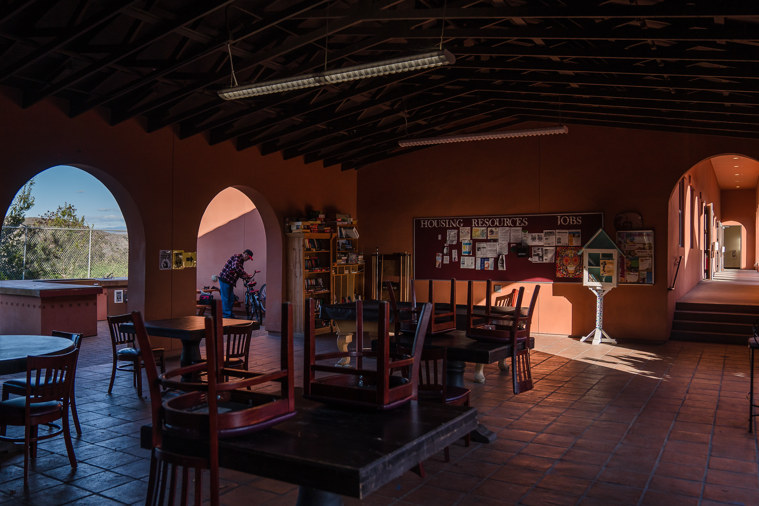 Micheal Weidekemper, 58 years old, works on his bike at La Posada de Guadalupe shelter in Carlsbad on Dec. 13, 2022.