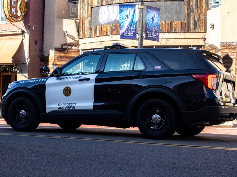 San Diego Police parked in the middle of the road to talk to a man yelling in Hillcrest on Dec. 20, 2022.
