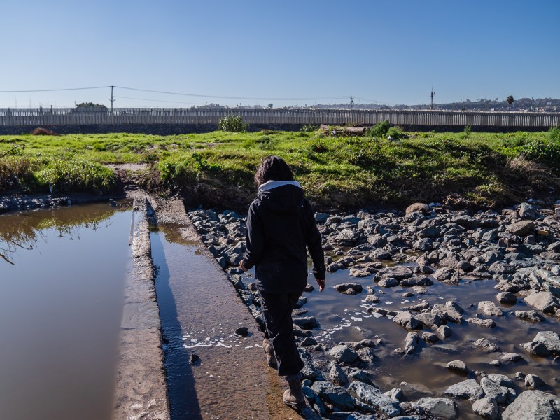 Stephany Garcia who is in the Master of Science program for Department of Geography at San Diego State University walks around the Tijuana River Valley on Dec. 20, 2022.