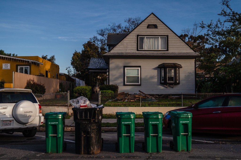 New food waste bins and garbage bin are lined up on the street in Grant Hill on Jan. 18, 2023.