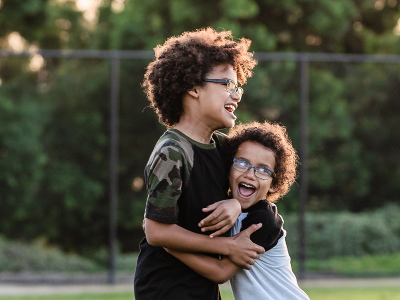 Children play outside during a YMCA after school program at Wolf Canyon Elementary School in Chula Vista on Nov. 29, 2022. / Photo by Ariana Drehsler