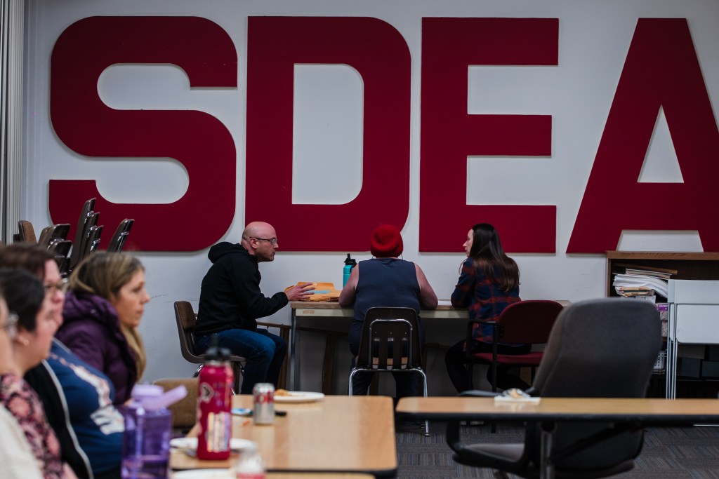 Members of the High Tech Education Collective count votes during a meeting at the San Diego Education Association on Feb. 2, 2023.
