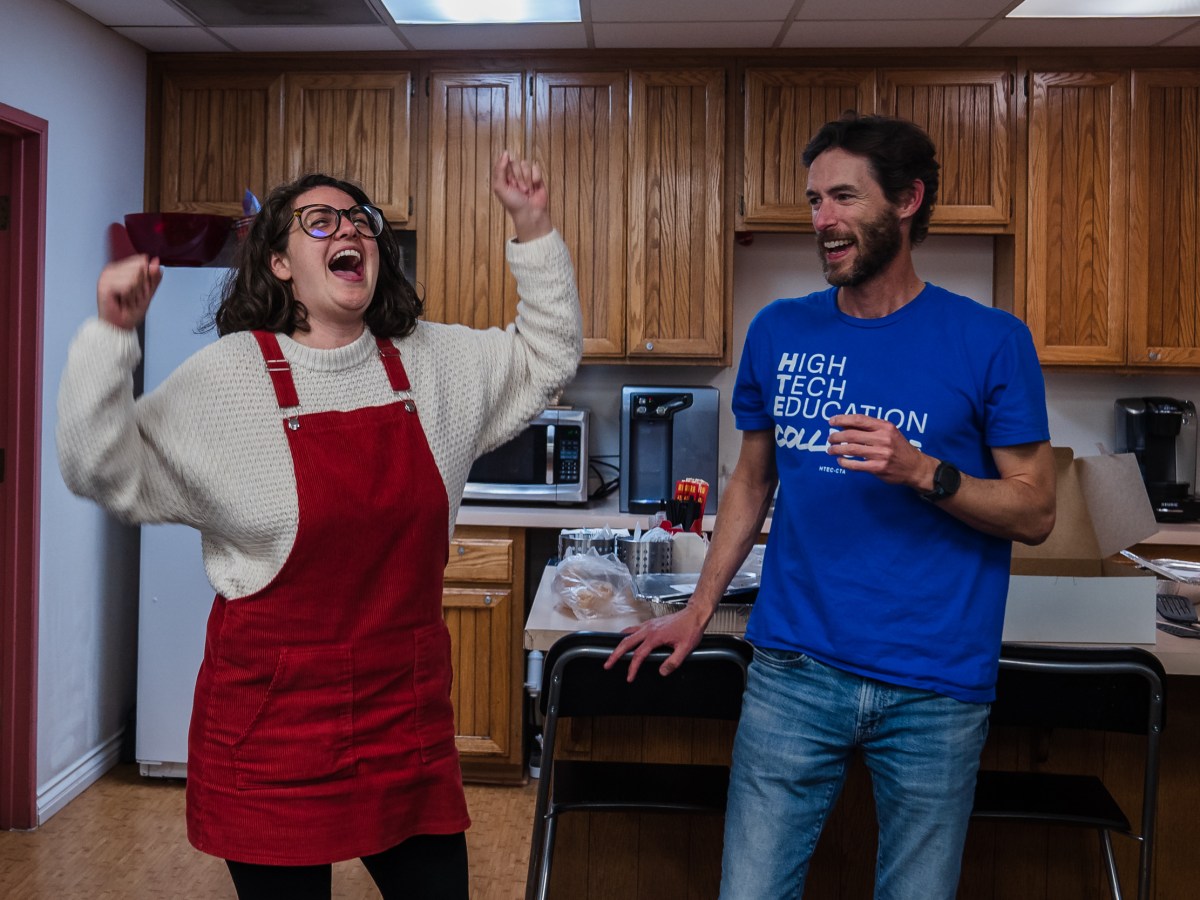 Hayden Gore, president and Roxanna Sepehri, vice president of High Tech Education Collective celebrate after the votes were counted from union members to ratify the contract at the San Diego Education Association on Feb. 2, 2023.