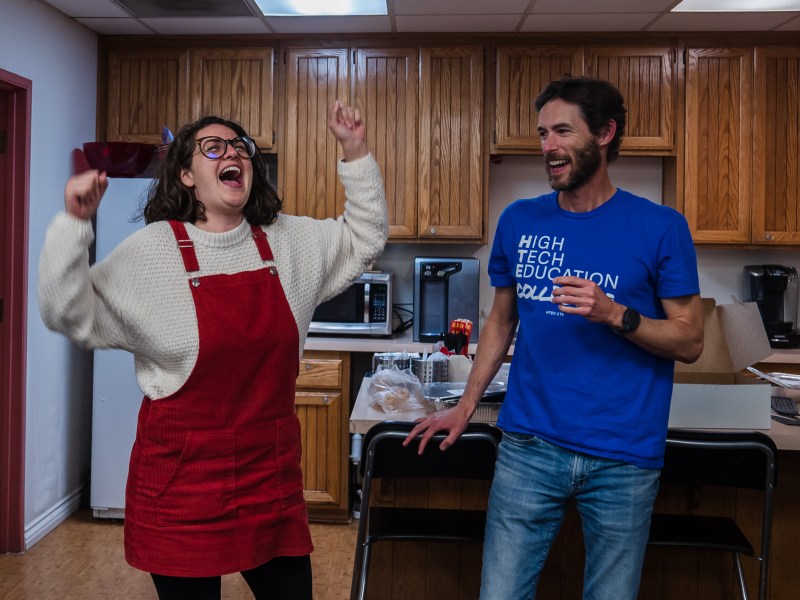 Hayden Gore, president and Roxanna Sepehri, vice president of High Tech Education Collective celebrate after the votes were counted from union members to ratify the contract at the San Diego Education Association on Feb. 2, 2023.
