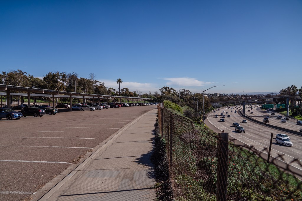 View of parking lot at Balboa Park's Inspiration Point next to the 5 Freeway on Feb. 3, 2023.