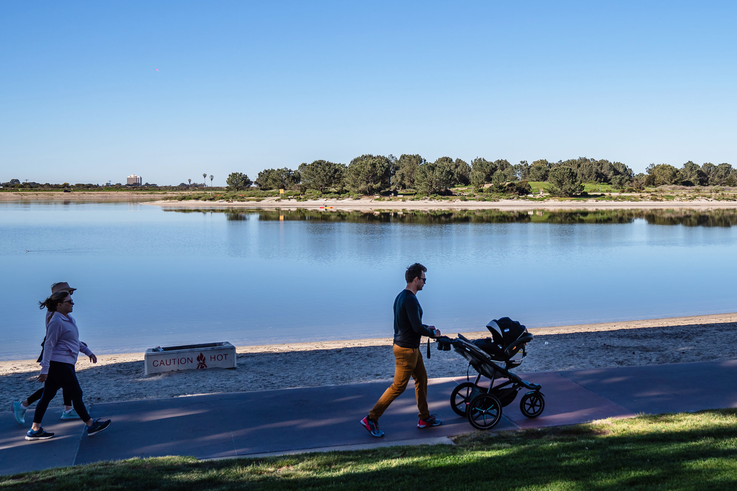 Isaac Howe walks with his daughter in Mission Bay on Feb. 9, 2023.