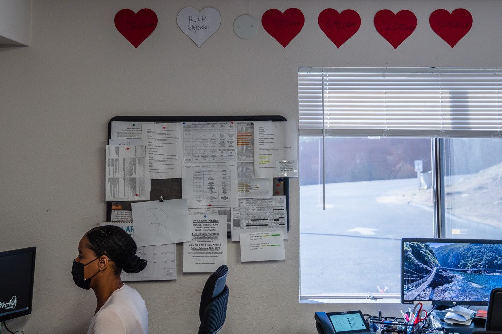 Five red hearts hang on the wall to symbolize the lives saved and one white heart for a client who died at McAlister Institute- Adult Detox in Lemon Grove on Feb. 10, 2023.