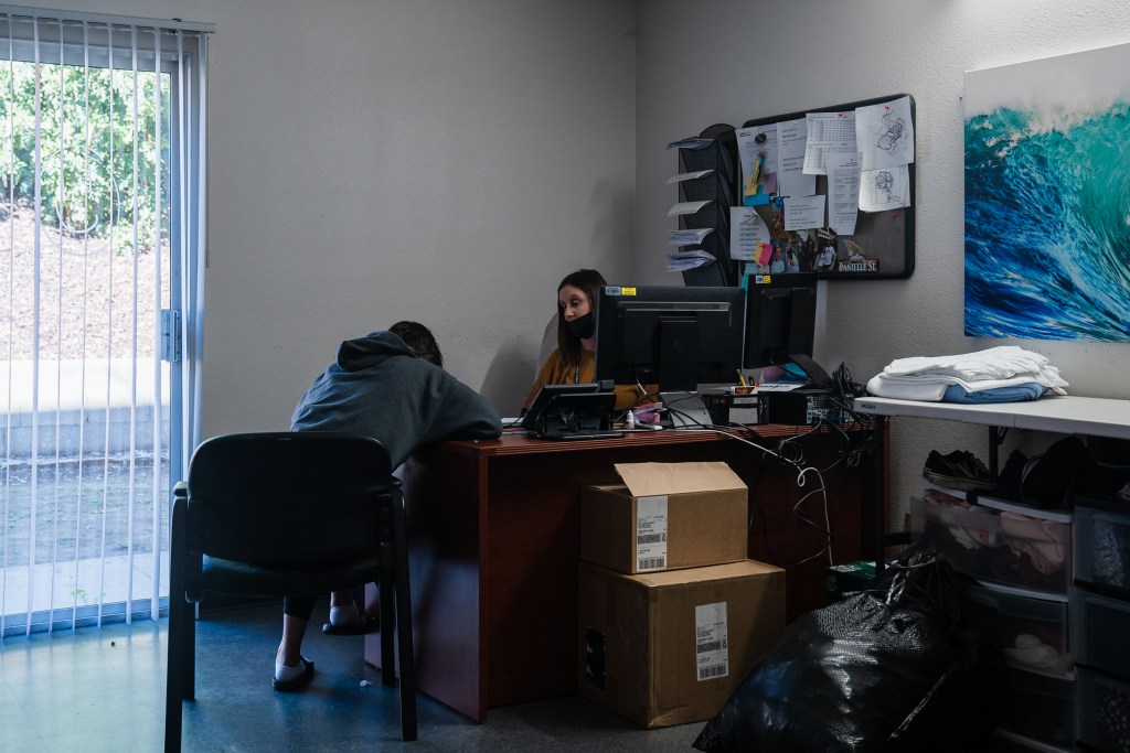 Intake Specialist Dannielle O'Brien speaks to a client at McAlister Institute- Adult Detox in Lemon Grove on Feb. 10, 2023.