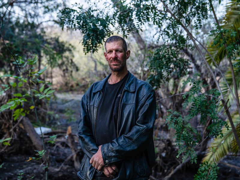 Chad Daniel Camou stands near the San Diego River in Mission Valley on Feb. 16, 2023.