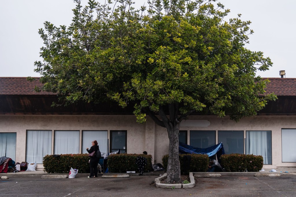 Unhoused people staying in front of vacated Oceanside Sobering Services Center on March 14, 2023.