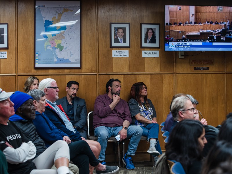 People sit in on a Land Use and Housing Committee meeting in city council chambers in downtown on April 13, 2023.