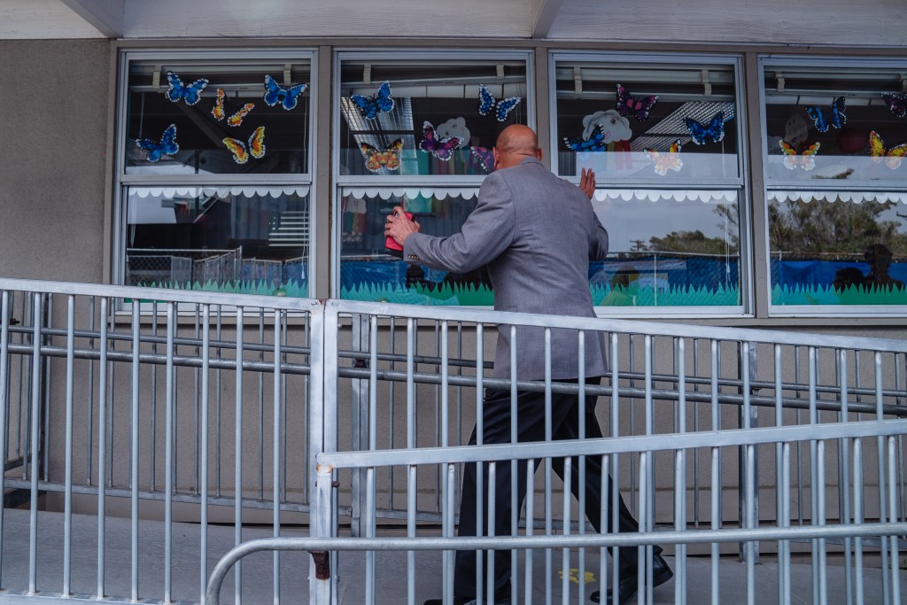 Superintendent of the San Diego Unified School District Dr. Lamont A. Jackson waves to students in a classroom at Spreckels Elementary school in University City on April 24, 2023.