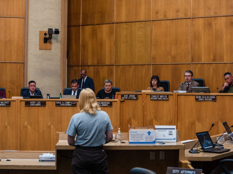 San Diego State student Maeve Howlett speaks about the proposed ban of homeless encampments during a city council meeting on April 10, 2023.