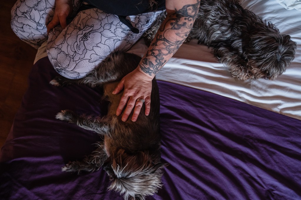 Tami Grobarek at Motel 6 with her dogs North and Rags in El Cajon on May 19, 2023.