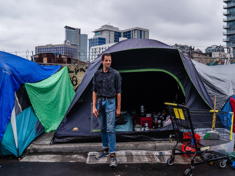 Sigma stands outside his tent in the East Village on June 14, 2023.