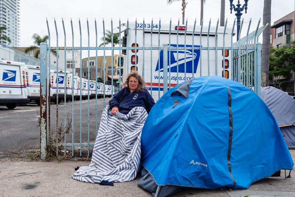 Roberta St. Denis sits in her walker near the post office in downtown on June 1, 2023.