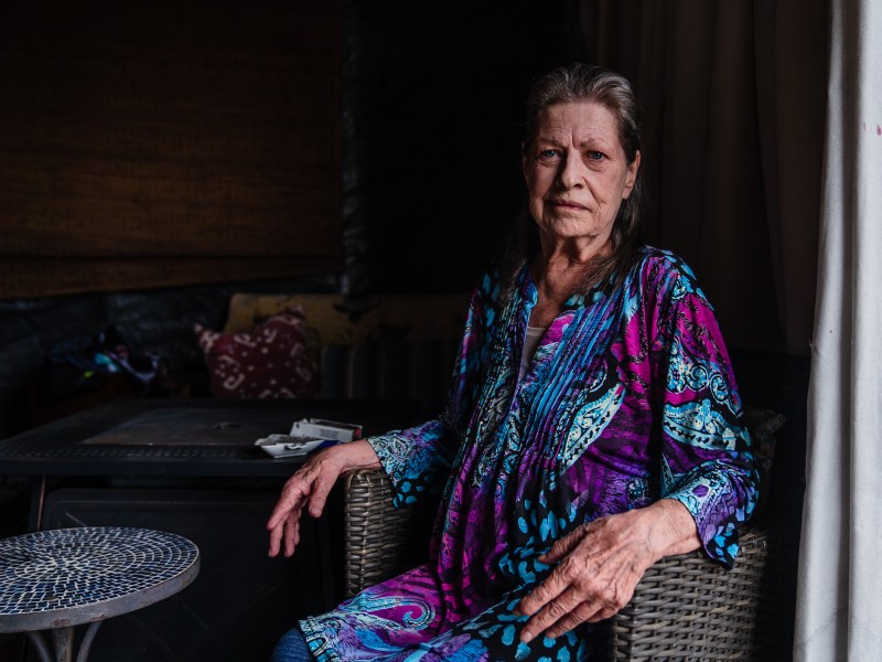 Pamela Peterson sits in the Patio that she shares with Mishele Stead in Golden Hill on July 27, 2023.