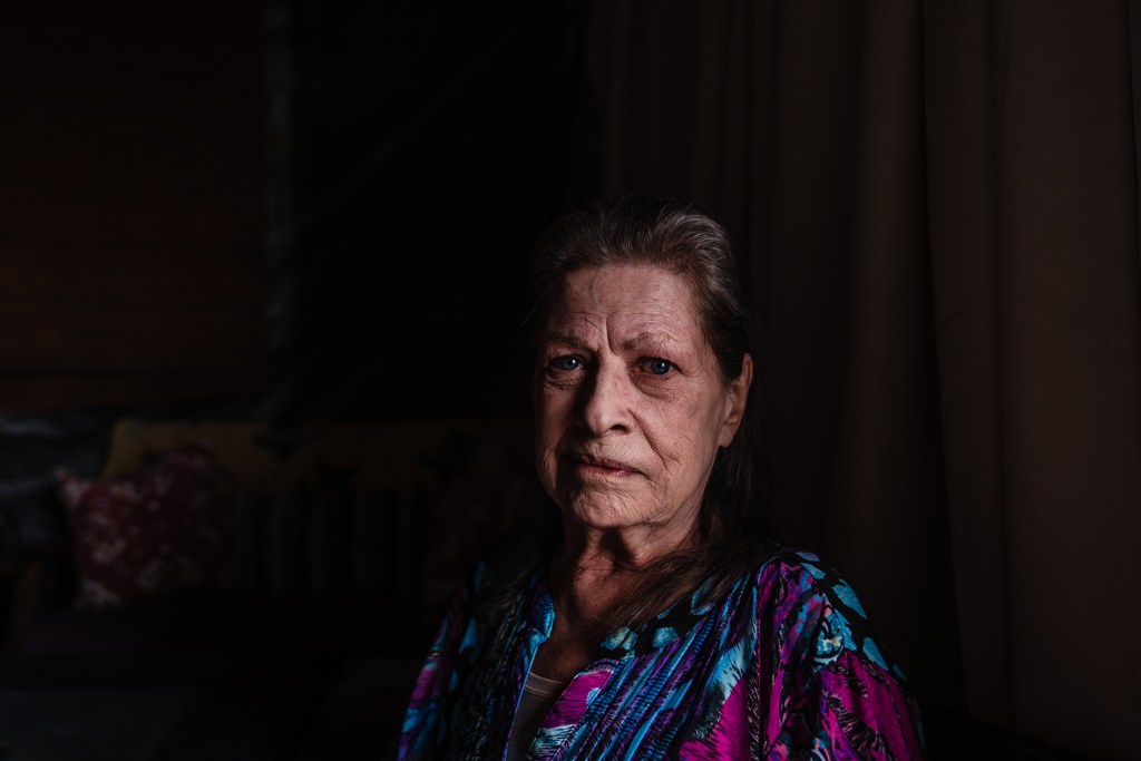 Pamela Peterson sits in the Patio that she shares with Mishele Stead in Golden Hill on July 27, 2023.