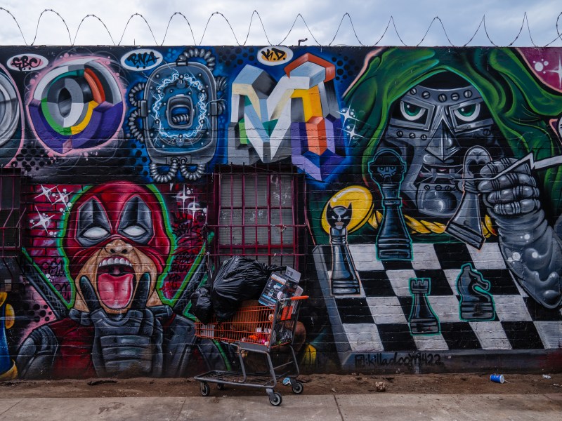 A shopping cart with belongings can be seen on Commercial Street in the outskirts of downtown on July 31, 2023.
