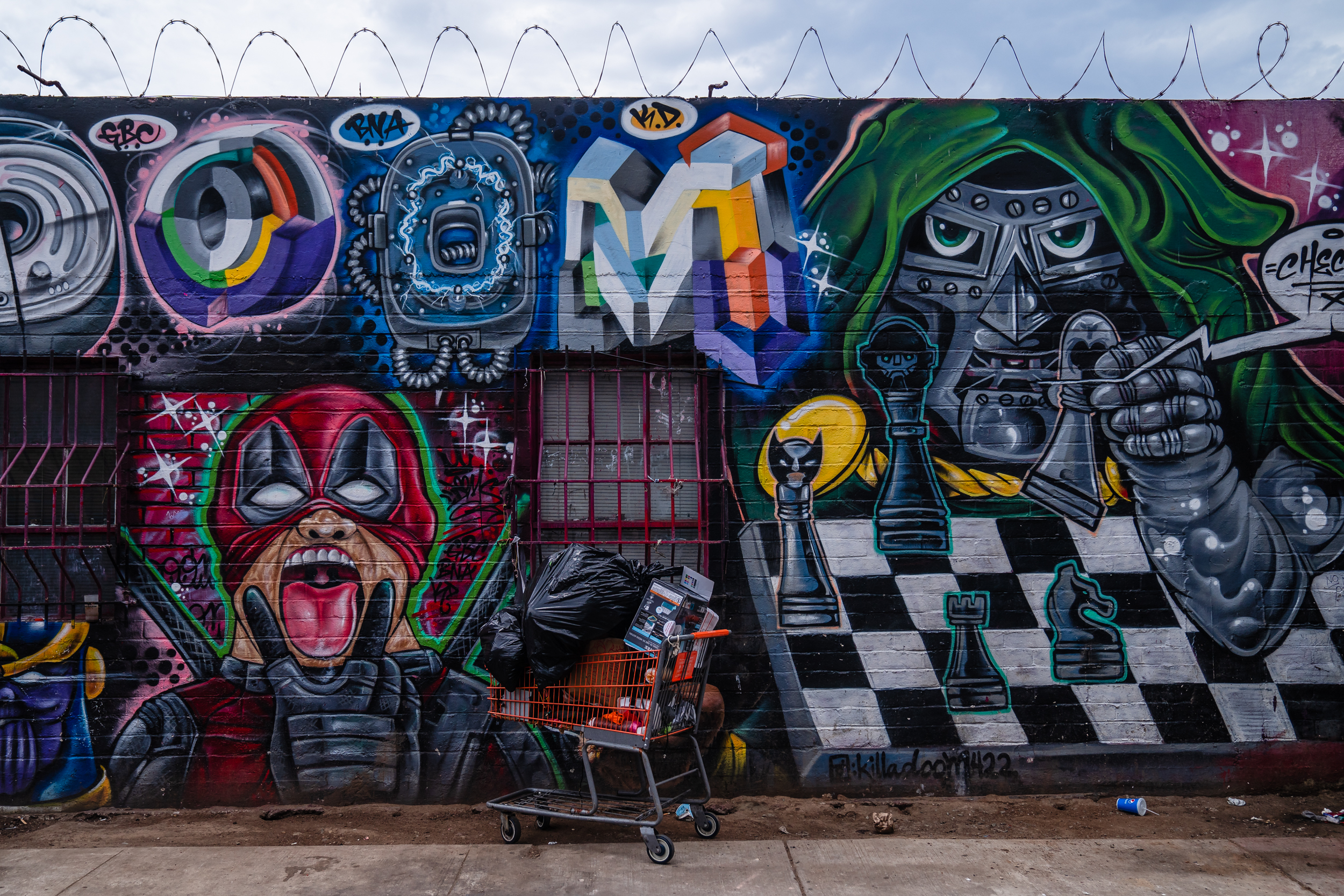 A shopping cart with belongings can be seen on Commercial Street in the outskirts of downtown on July 31, 2023.