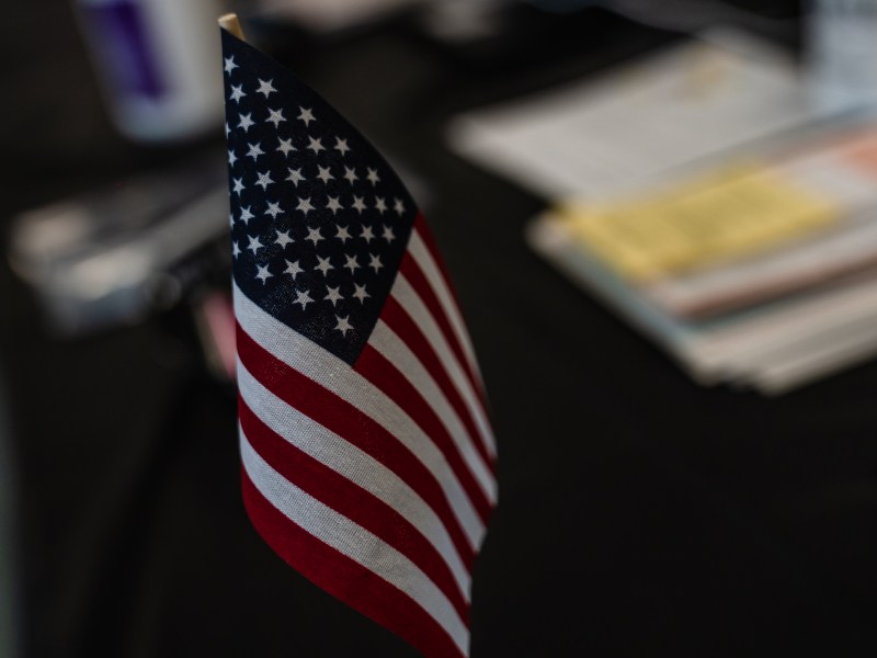 A small American flag sits on a table at the City Heights Recreation Center polling station on Aug. 15, 2023.