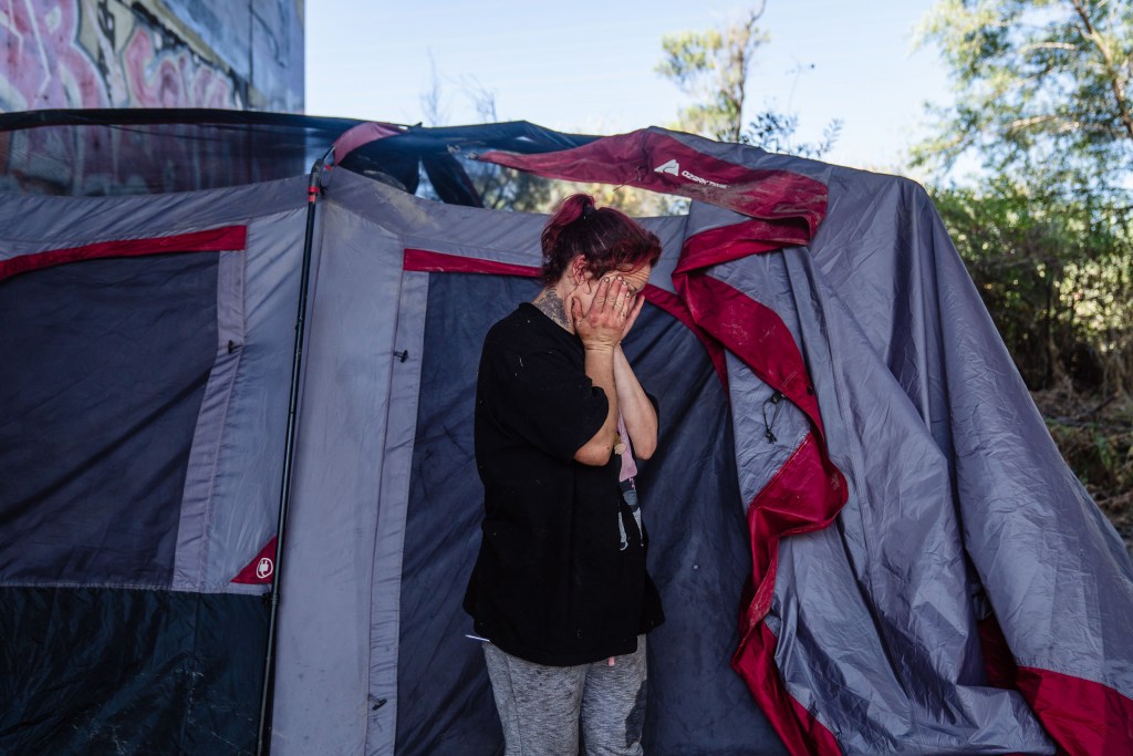 Claudia Alvarez, 33 in front of her tent in Mission Valley's riverbed on Aug. 22 2023. Alvarez has been homeless since she was 17 years old.